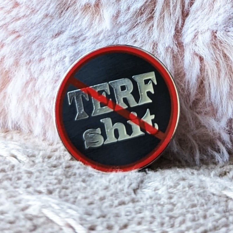 funny enamel pin that says "no TERF shit"