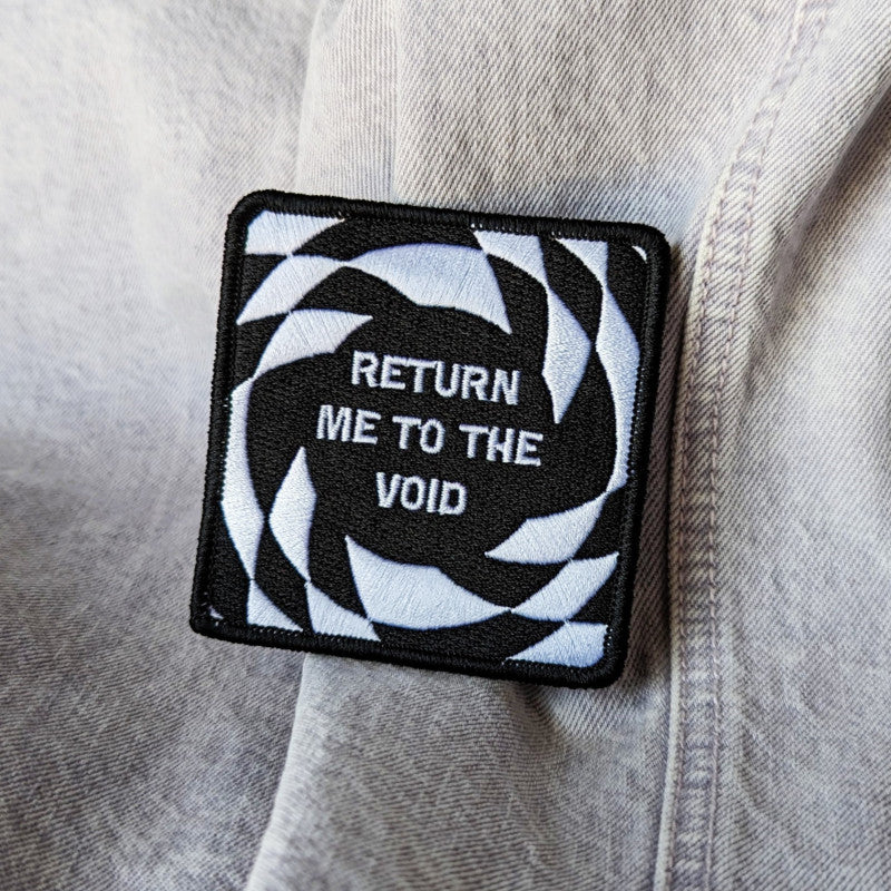 funny, trippy embroidered patch that reads "return me to the void"
