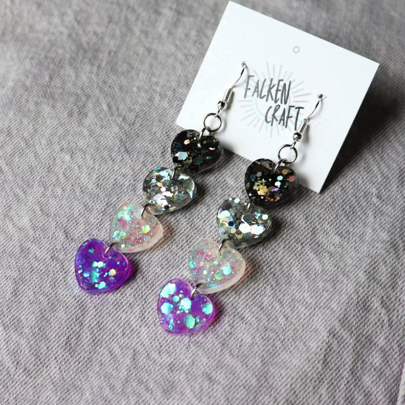 dangly earrings with hearts in the colors of the asexual flag