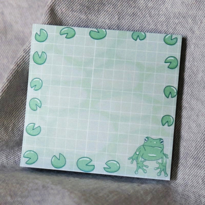 stack of post-it notes with a frog and lily pads