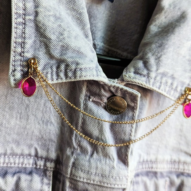 dark pink rhinestone lapel pins, with gold chains between them