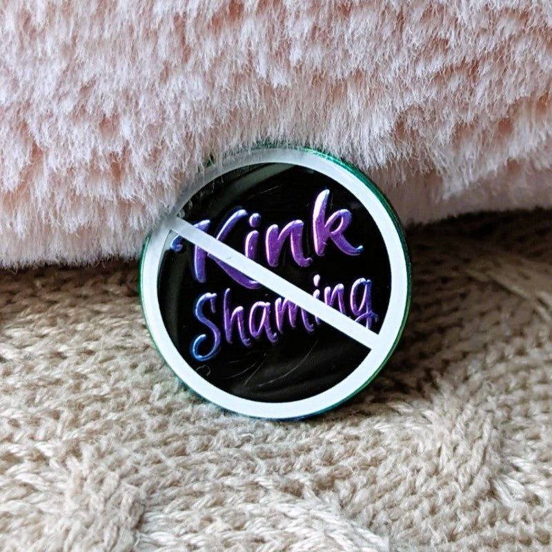 cool enamel pin that says "no kink shaming"