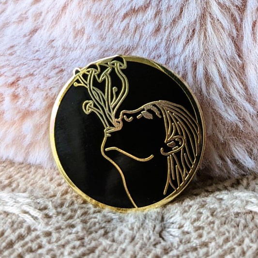 cool enamel pin of mushrooms growing out of a woman's mouth 