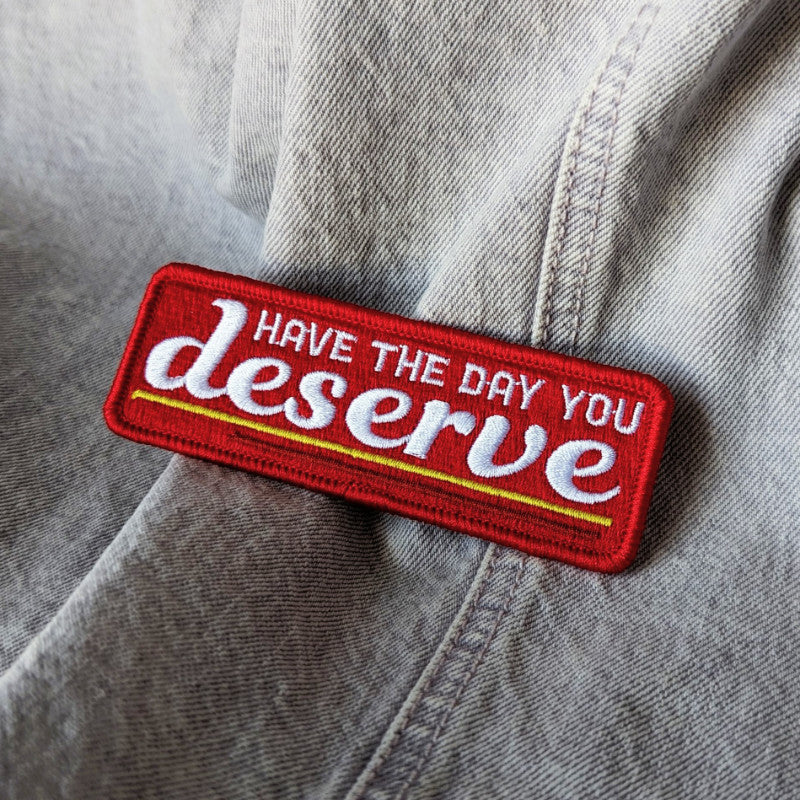 funny embroidered patch that says "have the day you deserve"