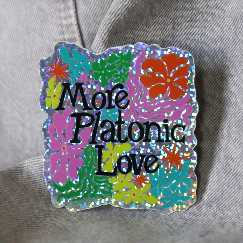 a groovy glitter sticker with flowers and the words "more platonic love"
