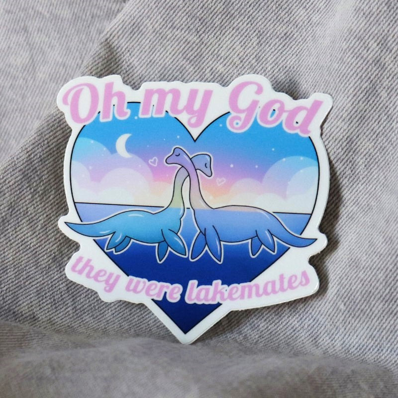 pretty sticker of two loch ness monsters and the words "oh my god they were lakemates"