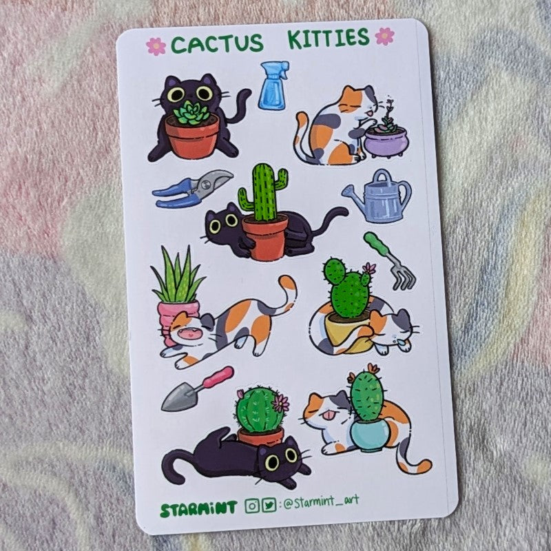 sheet of stickers showing cats, cactuses, and gardening tools