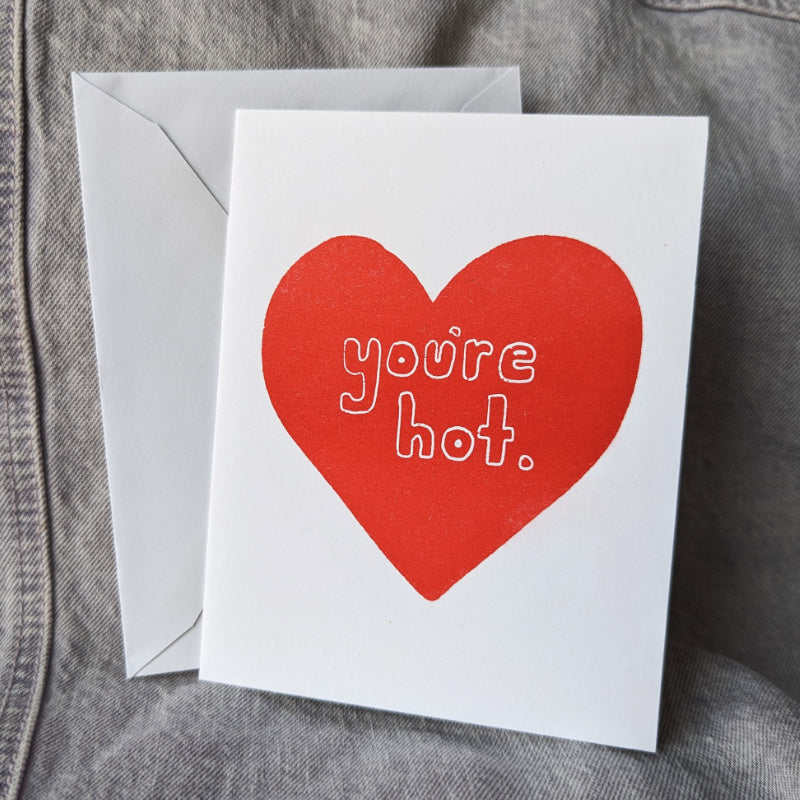 cute greeting card with a large heart and the words "you're hot"