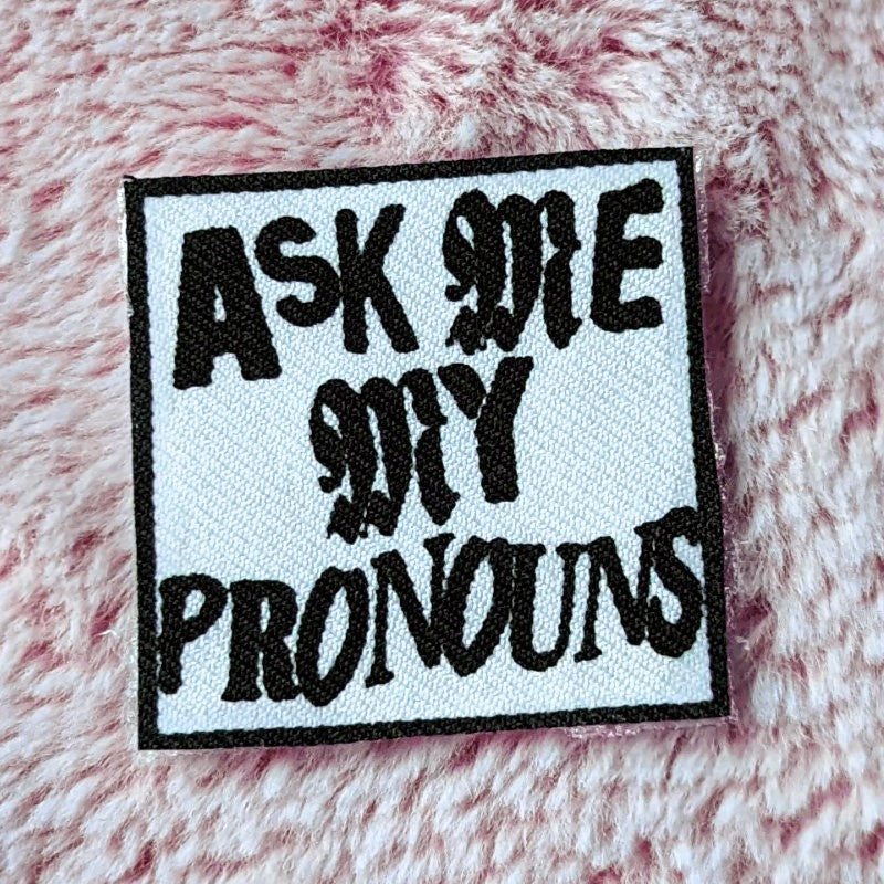 punk style iron-on canvas patch with the words "ask me my pronouns"