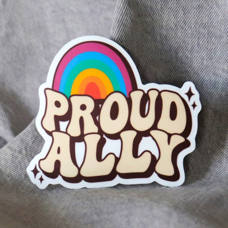 sticker that says "proud ally" under a rainbow
