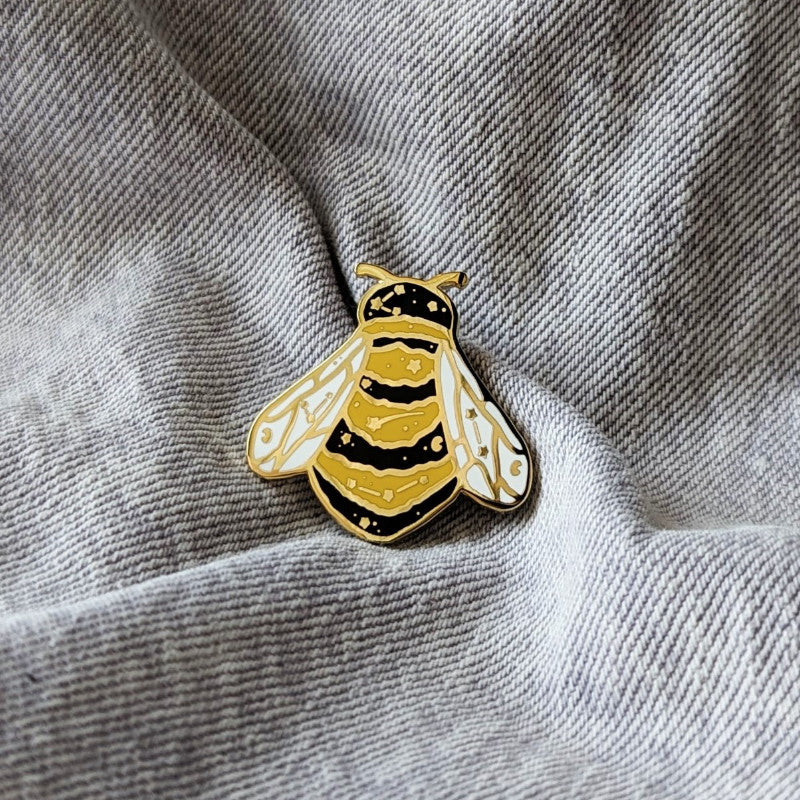 cute enamel pin of a bee with constellations on it