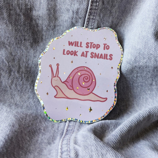 cute glitter sticker of a smiling snail that says "will stop to look at snails"