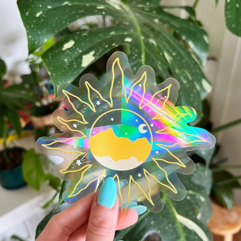 pretty suncatching sticker of a sun with a night sky inside it