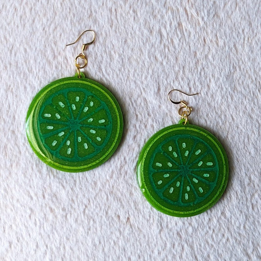 pretty and glittery resin earrings that look like a slice of a lime