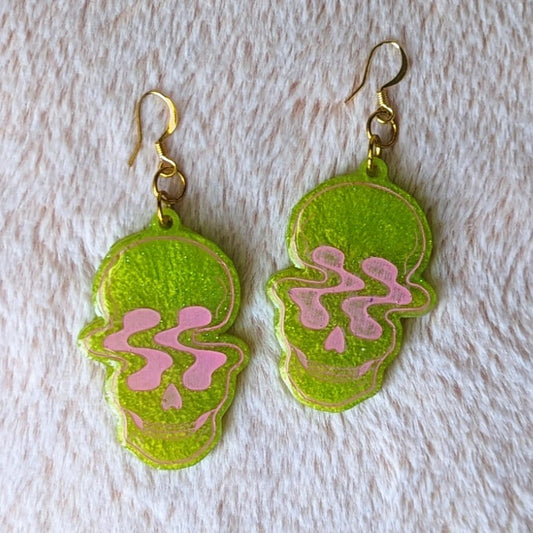 cool resin earrings of warped skulls