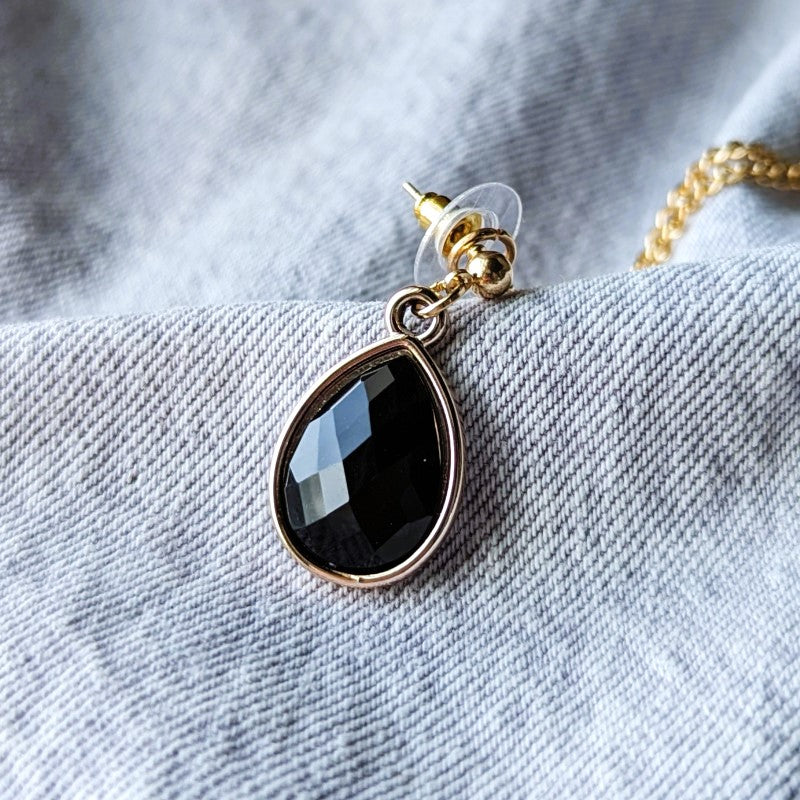 collar lapel pins with black rhinestones and a gold chain between them