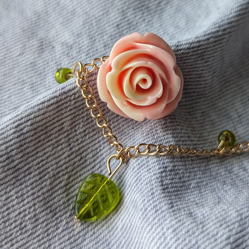 cute pink rose lapel pin, with a gold chain and leaf beads