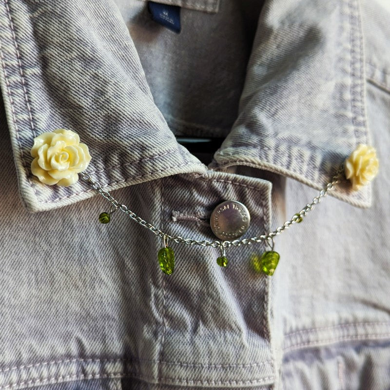 cute white rose lapel pins, with a gold chain and leaf beads between them