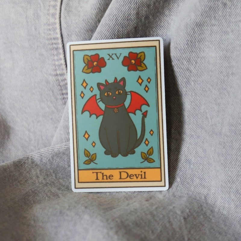 funny sticker featuring a tarot card of "the devil" with a black cat in a devil costume