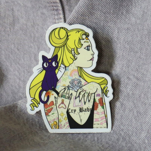 a tattooed usagi with a black cat on her shoulder